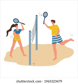 A woman and a man play beach tennis. Summer sports, tennis on the beach