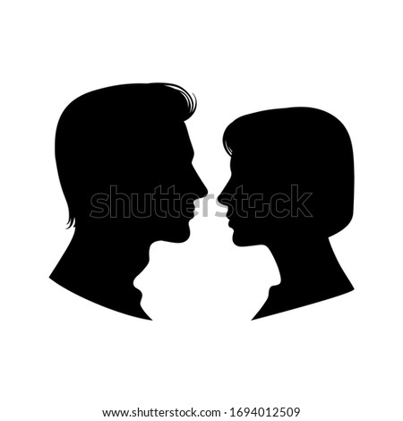 Similar – Man and woman face each other and look each other in the eyes