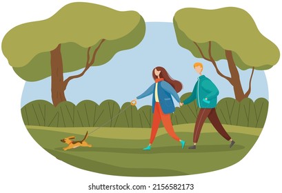 Woman and man walking with dog in spring park. Active lifestyle, outdoor recreation, family pastime concept. Couple spending time with pet in nature. People in relationship during walk together