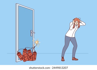 Woman manager sets off explosion to open door, covers ears with hands, standing near dynamite. Concept of being ready to do anything to achieve business goal in career of girl manager