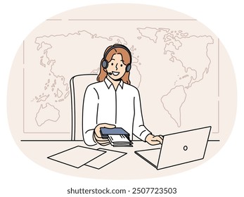 Woman manager of travel agency sits at office desk and holds passport with visas and plane tickets. Tour operator company representative in headphones near giant map of world helps to travel