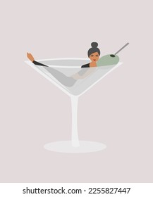 Woman in a martini cocktail glass. Alcoholism concept