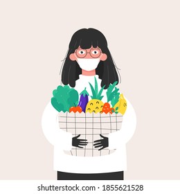 Woman in mask and gloves with a basket of groceries. Safe shopping. Healthy and proper nutrition. Virus protection, hygiene and safety rules.