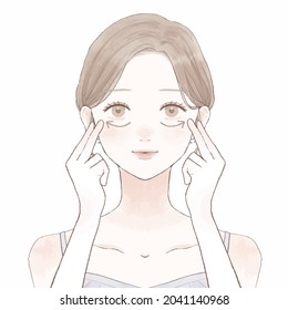 Woman massasing under eyes. On a white background.