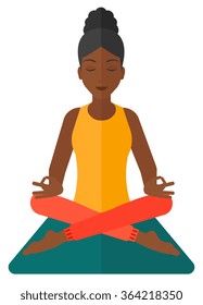 Woman meditating in lotus pose.