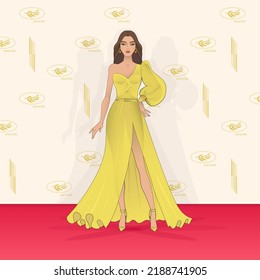 Woman Model In A Yellow Evening Dress On The Red Carpet. Mass Cultural Event, Award Ceremony. Place For A Photo Of The Participants Of The Event. Press Wall, Backstage.