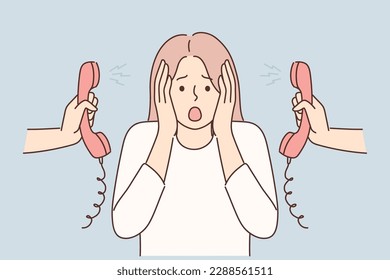 Woman is nervous about lot of phone calls and intrusive telemarketing or spam. Girl clutches head stands among telephone handsets for concept of problems with multitasking and overload at work