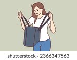 Woman is nervous looking into purse and seeks lost keys or purse forgotten at home. Confused girl stands with bag in hands, and is disappointed after learning about theft of wallet with money