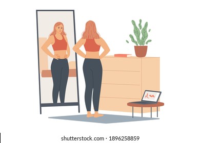 Woman not happy with her weight, she looks at her belly and waist, stands in front of a mirror and looks at her body after training.