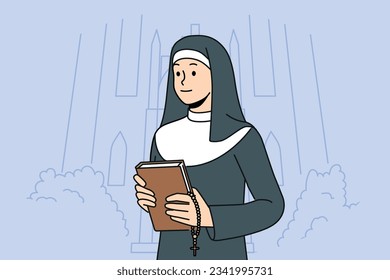 Woman nun with bible stands near church calling to visit christian shrines and study gospel or religious prayers. Catholic nun in white and black cassock holds cross for traditional orthodox rituals.