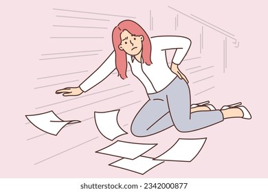 Woman office worker fell down stairs and injured back dropping papers on floor. Businesswoman fell due to excessive haste associated with strict deadlines or fatigue from overwork.