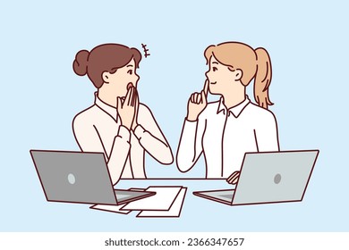 Woman office workers gossip and share secret forbidden for distribution, sitting at table with laptops and papers. Girls gossip and make shh sign forbidding data dissemination due to NDA contract