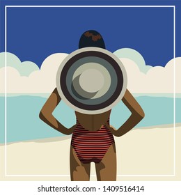 Woman on the Beach wearing a sun hat