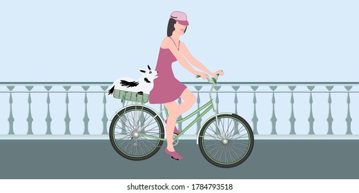 A woman on a bicycle with a dog in a basket rides on the bridge - vector. World Car Free Day. Banner horizontal.