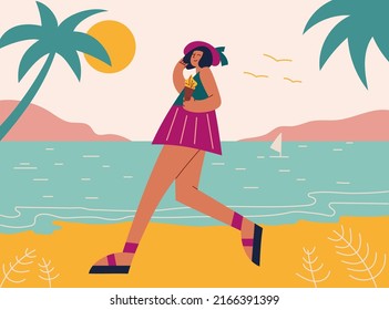 Woman on summer vacation concept. Pretty Girl tanned walking on beach, enjoying leisure. She holds ice cream in her hand. Concept for outdoor activities and summer travel topics.