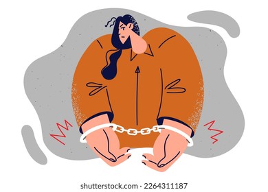 Woman in orange prisoner jumpsuit with hands shackled by handcuffs is sad about upcoming prison sentence or court hearing. Girl prisoner needs support of lawyer to get fair decision judge after crime 