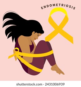 mujer con dolor por endometriosis al lado de un lazo amarillo