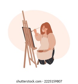 Woman painter, artist in an apron draws with a brush on canvas at the easel. Creative profession and hobby concept.