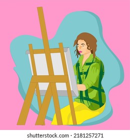 a woman is painting on a canvas. a woman who has a hobby of painting to fill her spare time