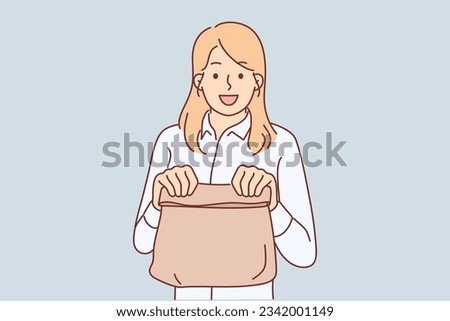 Woman with paper bag from store recommends use of biodegradable shopping packaging to protect nature from plastic. Happy girl with paper bag with breakfast bought in takeaway bakery