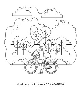 woman in the park with bicycle