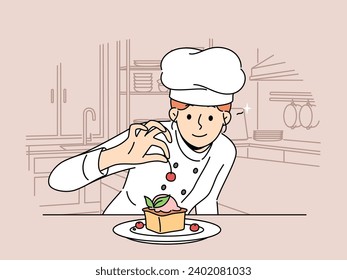 Woman pastry chef prepares dessert cake with fresh berries standing in kitchen of restaurant or bakery. Girl decorates cheesecake with cherry before serving dessert to cafeteria customer.