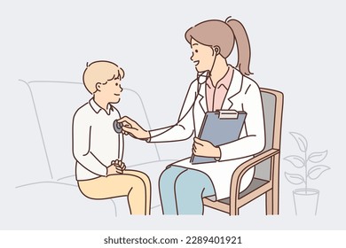 Woman pediatrician uses stethoscope listening to heartbeat of child during routine pre-school checkup. Girl doctor or gp in private hospital examines boy with symptoms of infectious flu 