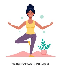 A woman is performing a yoga pose balancing on one leg