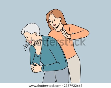 Woman performs heimlich maneuver for choking old man who needs help due to airway obstruction. Sick human choked on food and coughed standing near girl ready to do heimlich maneuver