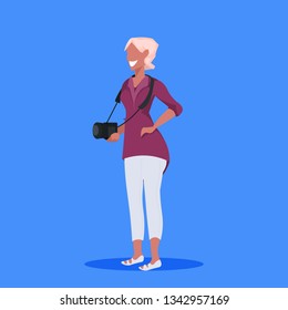 woman photographer holding camera female journalist reporter professional occupation concept cartoon character full length flat blue background