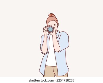 Woman photographer is taking images photo with dslr camera simple korean style illustration