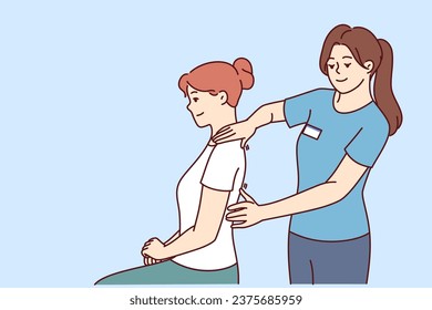 Woman physiotherapist gives massage to patient to relieve shoulder or back pain after failed workout. Girl works as physiotherapist and is engaged in chiropractic and helping people with sick spine