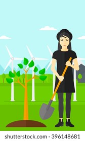 Woman plants tree.