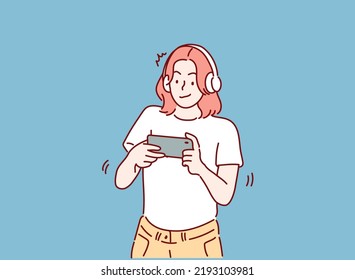 woman play mobile game on smartphone. Hand drawn style vector design illustrations.