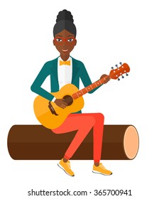 Woman playing guitar.