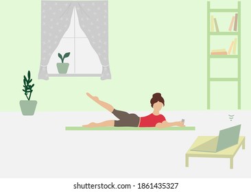 A woman plays sports in a room in front of a computer. Physical exercises at home using remote technologies.