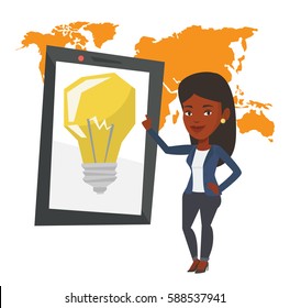 Woman pointing at tablet computer with a idea bulb on a screen. Busineswoman standing near tablet computer on the background of world map. Vector flat design illustration isolated on white background.
