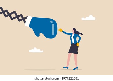 Woman power or feminism challenge, career competitive or gender equality concept, strong businesswoman executive wearing boxing glove fighting with big fist.