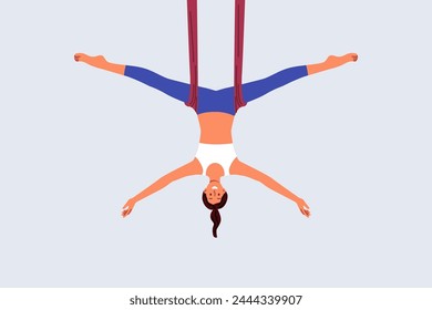 Woman practices aerial yoga, doing suspended stretching exercises to improve body health and flexibility. Aerial yoga trainer girl recommends enrolling in pilates or aerobics courses