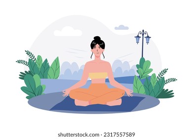 A woman practices meditation in a peaceful garden to begin her day with calmness.