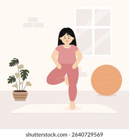 Woman practicing yoga indoors in tree pose