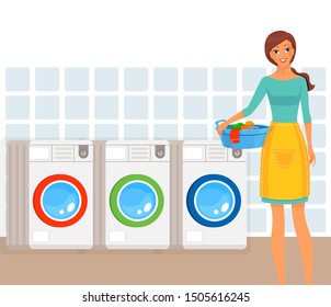 Woman in process of loading clothes into washing machine