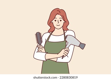 Woman professional hairdresser from barbershop holding comb and hair dryer to care for client hairstyle. Girl working as hairdresser in beauty salon stands with arms crossed and looks at camera