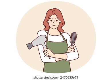 Woman professional hairdresser from barbershop holding comb and hair dryer to care for client hairstyle. Girl working as hairdresser in beauty salon stands with arms crossed and looks at camera