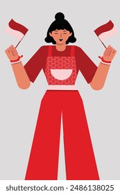 woman proudly holding 2 small Indonesian flags. indonesia independence day
