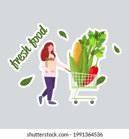 woman pushing trolley cart with different vegetables healthy lifestyle vegan fresh food concept full length