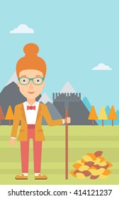 Woman with rake standing near heap of autumn leaves.