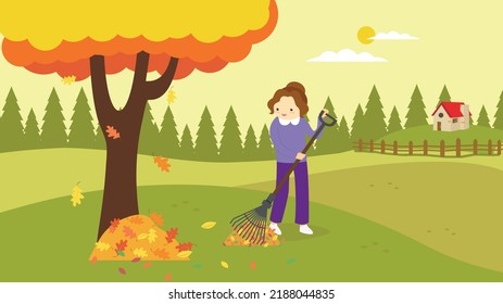 Woman raking leaves in the garden