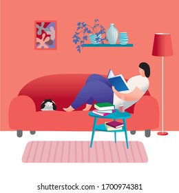 A woman is reading a book at home. Self-isolation during quarantine. Stay home to avoid the spread of coronavirus.