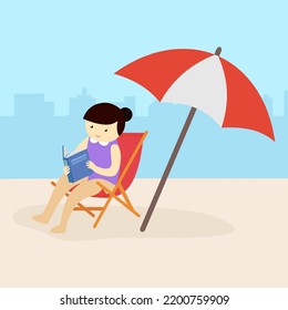 woman reading a book on the beach